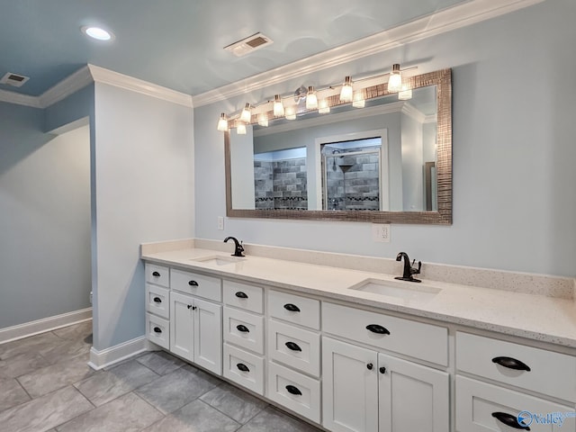 bathroom with a tile shower, vanity, and ornamental molding