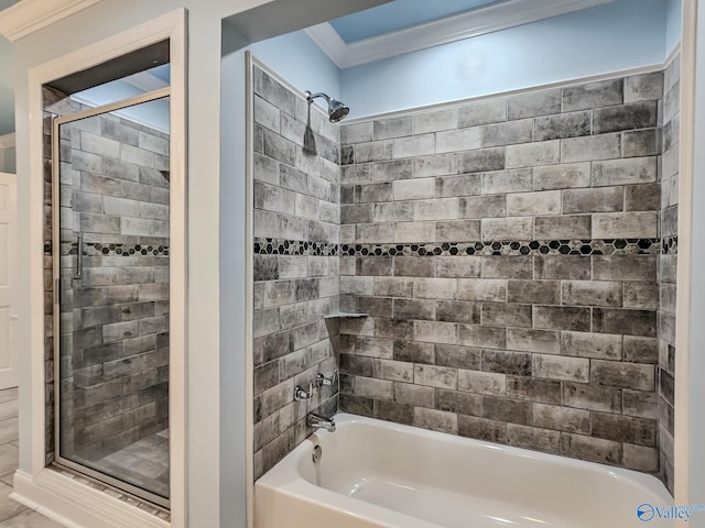 bathroom with ornamental molding and a wealth of natural light