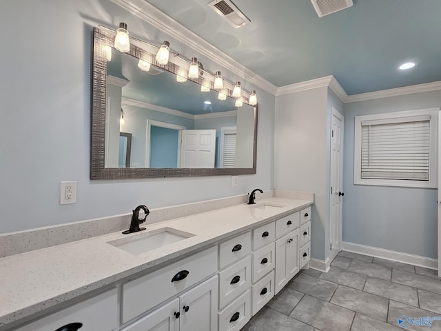 bathroom with ornamental molding, tile patterned floors, and vanity