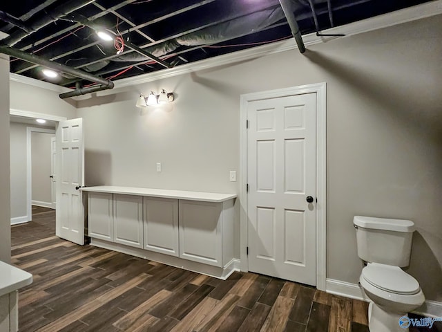 interior space with crown molding and dark hardwood / wood-style flooring