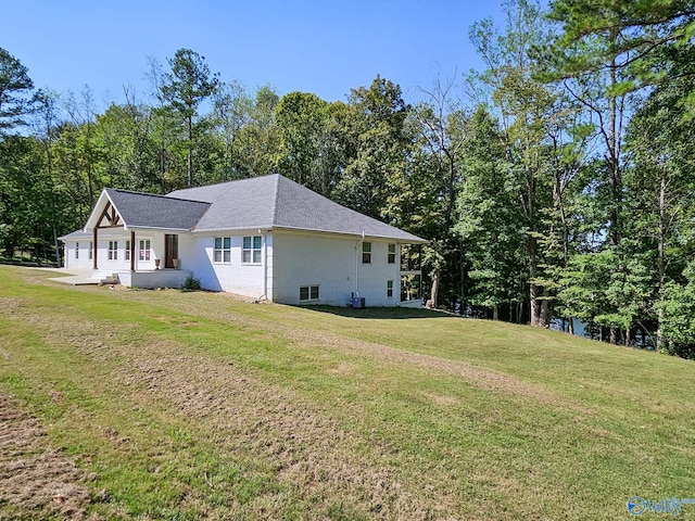 view of home's exterior featuring a yard