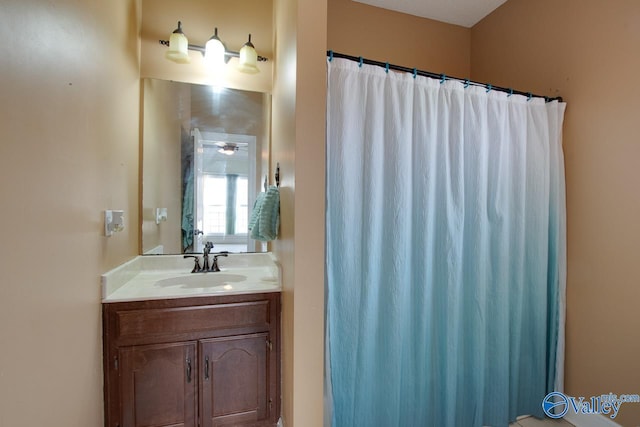 full bathroom featuring vanity and a shower with curtain