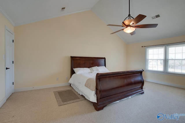 bedroom with baseboards, ornamental molding, carpet flooring, and vaulted ceiling