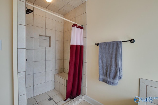 bathroom featuring a shower stall