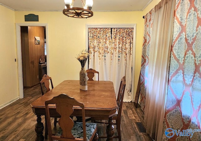 110 Circle Dr, Sand Rock, AL 35983 - dining space with dark wood-style flooring, a chandelier, crown molding, and baseboards