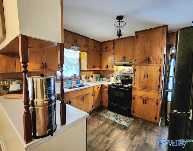 110 Circle Dr, Sand Rock, AL 35983 - kitchen with black appliances, a sink, and brown cabinets