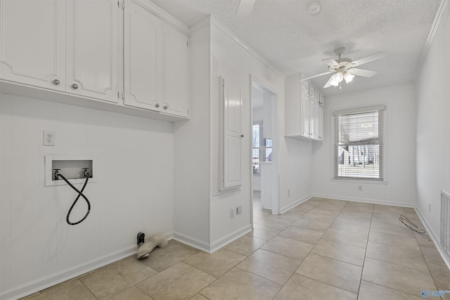 laundry room featuring light tile patterned floors, a ceiling fan, ornamental molding, washer hookup, and a textured ceiling