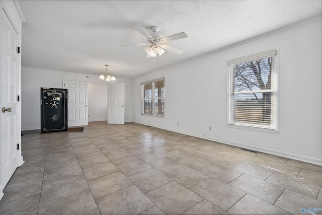 unfurnished living room featuring a wealth of natural light, visible vents, ceiling fan with notable chandelier, and a textured ceiling