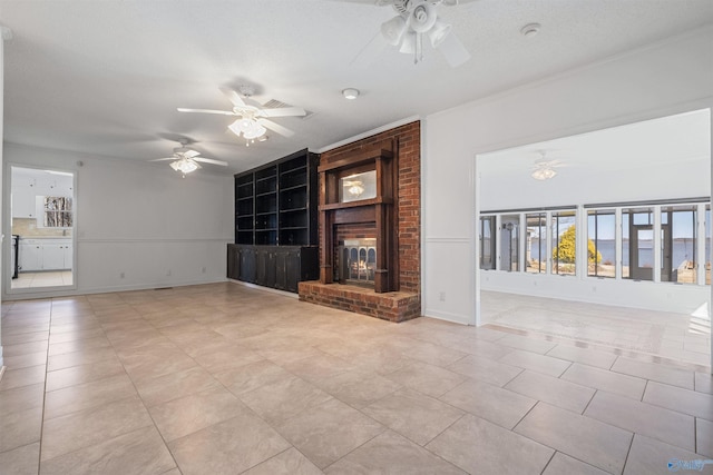 unfurnished living room featuring a brick fireplace, light tile patterned floors, baseboards, and ceiling fan