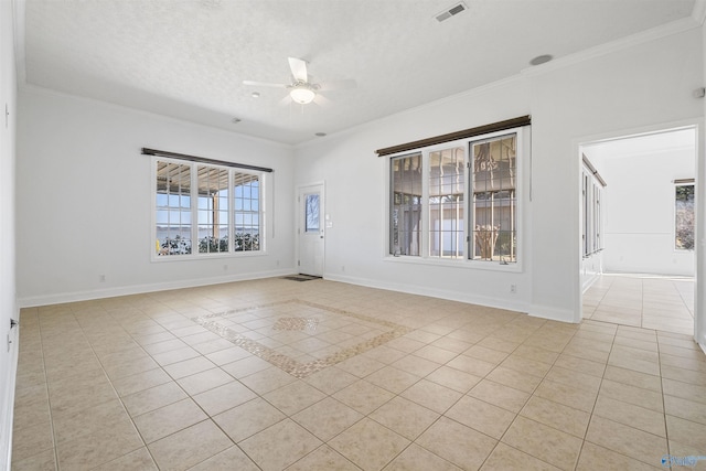 unfurnished room with light tile patterned floors, baseboards, visible vents, and ceiling fan