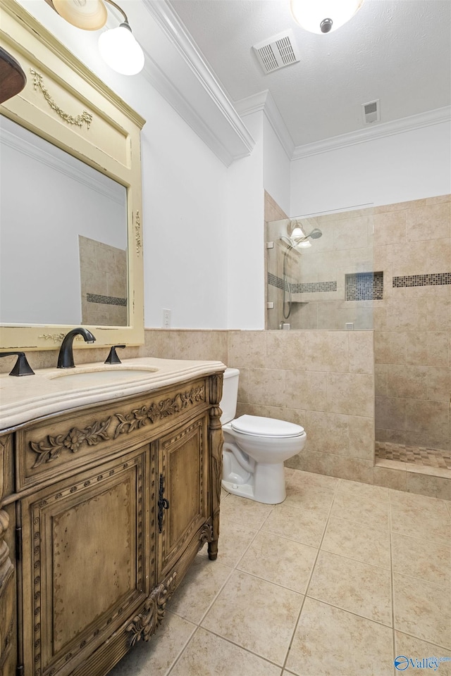 full bathroom with visible vents, toilet, tile walls, and crown molding