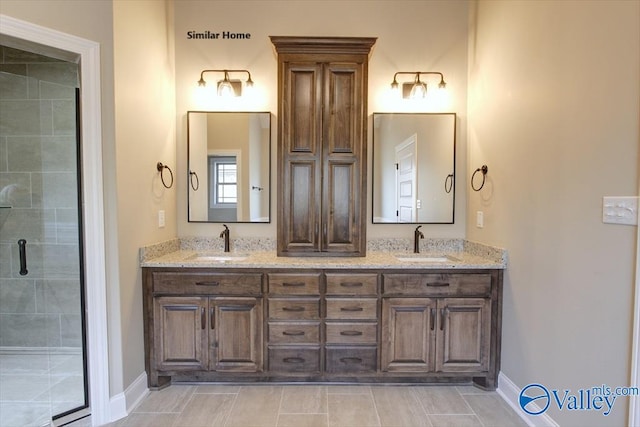 bathroom featuring vanity and a shower with shower door