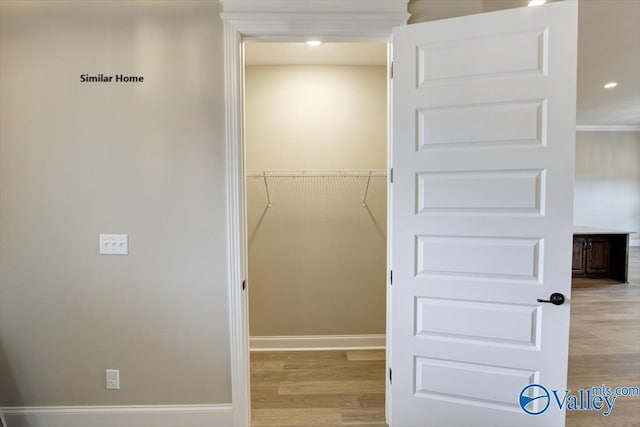 walk in closet featuring light hardwood / wood-style floors