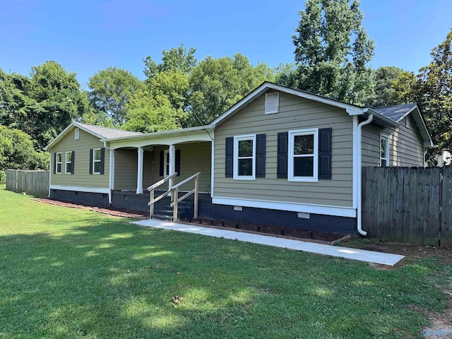 view of front of home with a front yard and covered porch