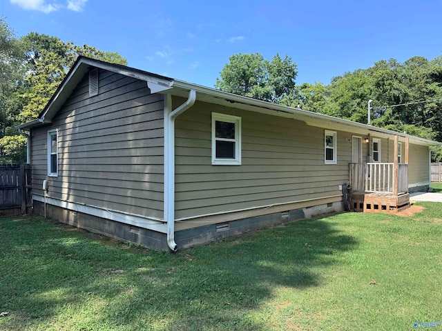 view of property exterior with a lawn