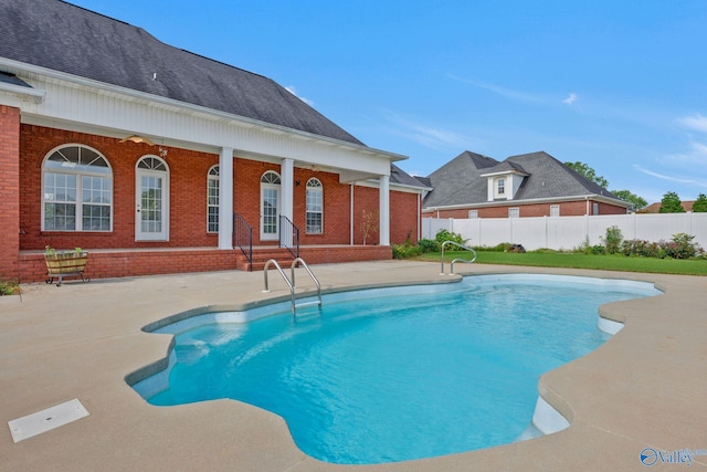 view of pool with a patio area, fence, and a fenced in pool