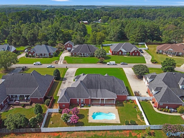 birds eye view of property with a residential view and a forest view