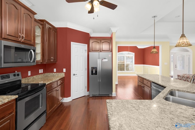 kitchen featuring pendant lighting, sink, dark hardwood / wood-style floors, ceiling fan, and stainless steel appliances