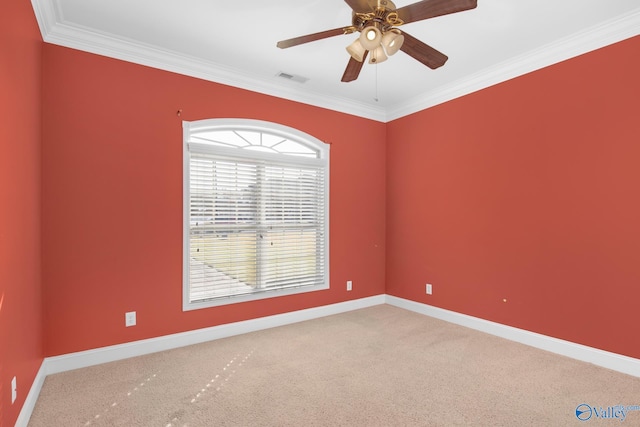 unfurnished room with carpet, ceiling fan, and crown molding