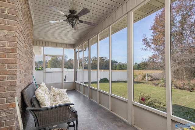 sunroom featuring ceiling fan