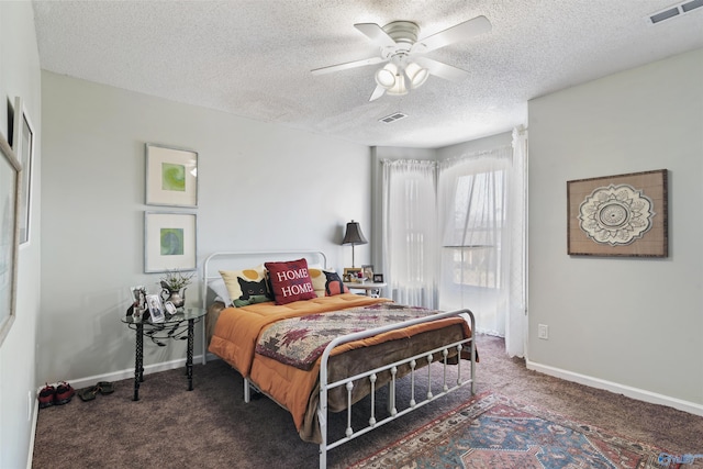 carpeted bedroom with visible vents, baseboards, and ceiling fan