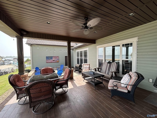 view of patio / terrace with ceiling fan, outdoor dining space, outdoor lounge area, and fence