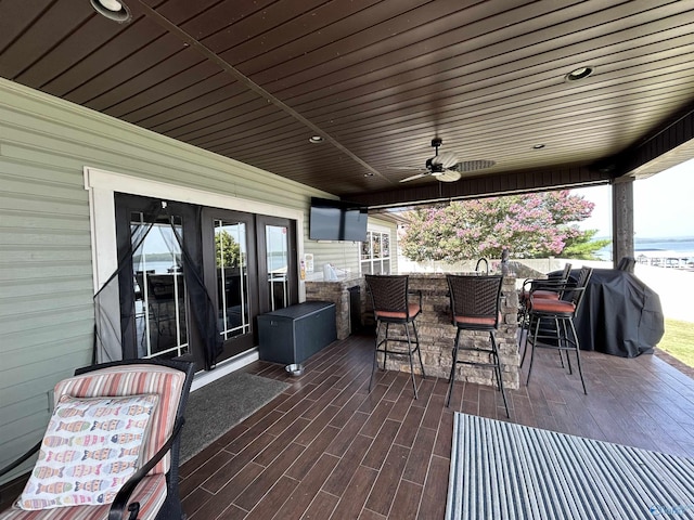 view of patio / terrace with ceiling fan, area for grilling, french doors, and outdoor dining space