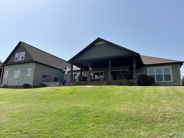 view of patio featuring a water view and ceiling fan