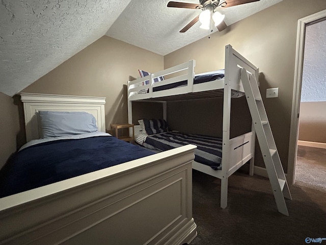 bedroom featuring a textured ceiling, ceiling fan, baseboards, vaulted ceiling, and dark colored carpet