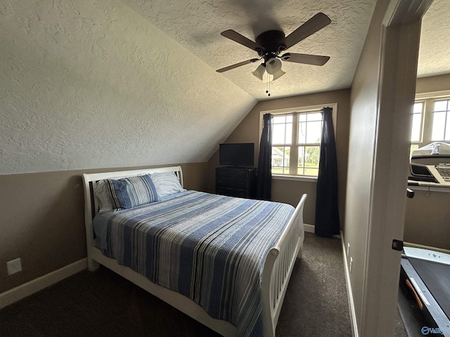 carpeted bedroom featuring a textured ceiling, multiple windows, and lofted ceiling