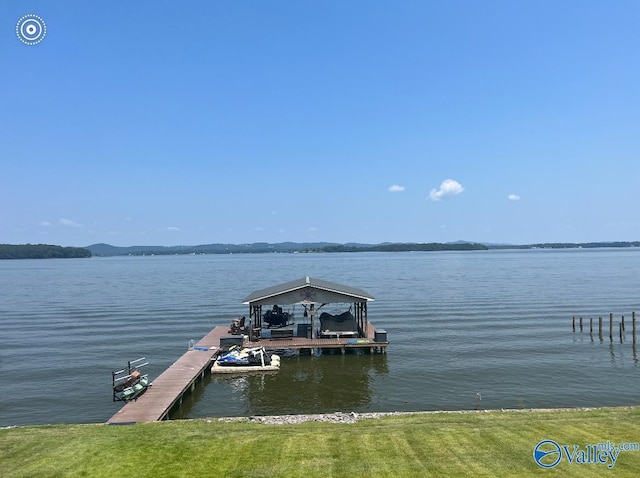 dock area featuring a water view