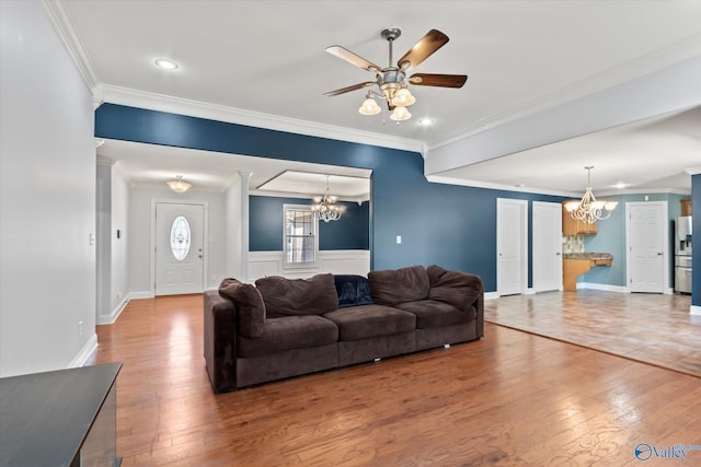 16968 Bellewood Dr, Athens, AL 35613 - living area with crown molding, baseboards, hardwood / wood-style floors, and ceiling fan with notable chandelier
