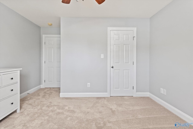 16968 Bellewood Dr, Athens, AL 35613 - unfurnished bedroom featuring light colored carpet, baseboards, and a ceiling fan
