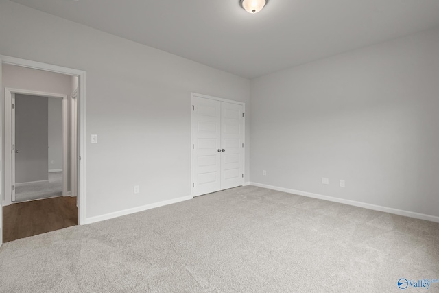 416 Tracer St, Huntsville, AL 35811 - unfurnished bedroom featuring a closet, baseboards, and carpet floors