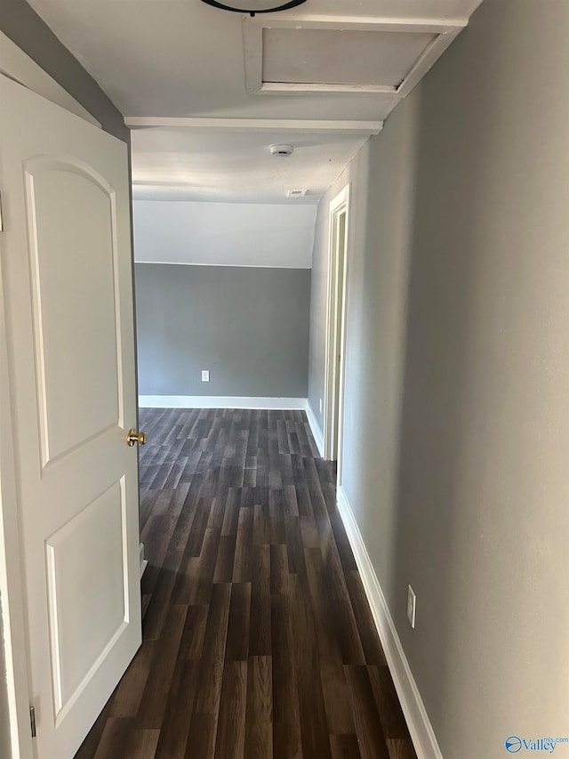 corridor featuring dark hardwood / wood-style floors