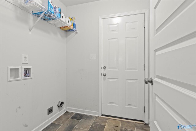 laundry room with electric dryer hookup, washer hookup, and dark tile patterned flooring