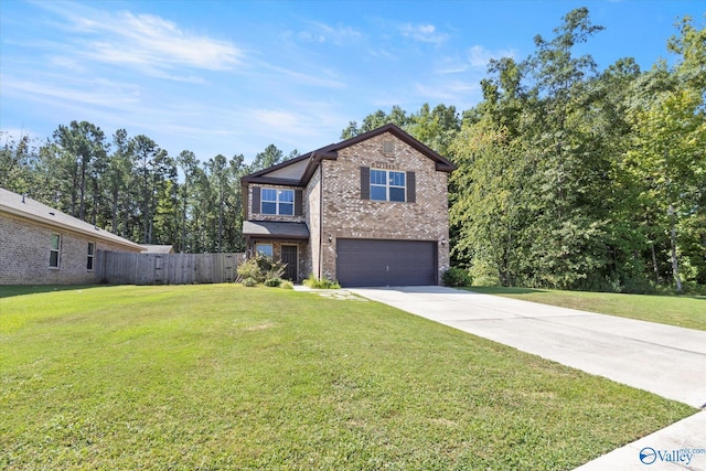 view of front of property featuring a garage and a front lawn