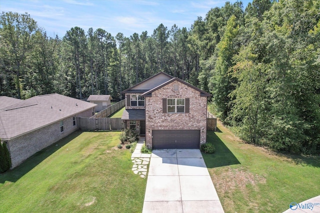 view of front of home with a garage and a front lawn