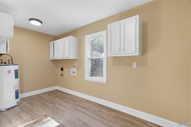 laundry room featuring cabinets, hookup for a washing machine, water heater, and light wood-type flooring