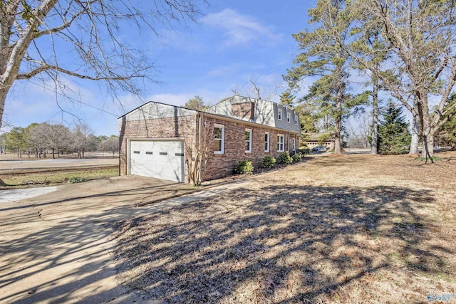 view of side of home featuring a garage