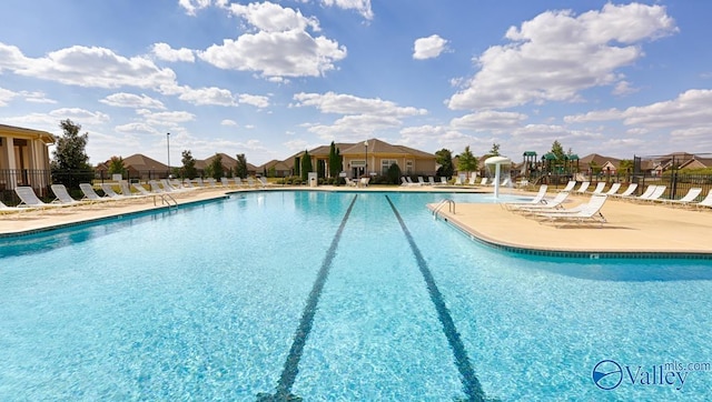 view of swimming pool featuring a patio area