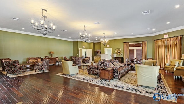 living room with hardwood / wood-style floors, an inviting chandelier, and ornamental molding