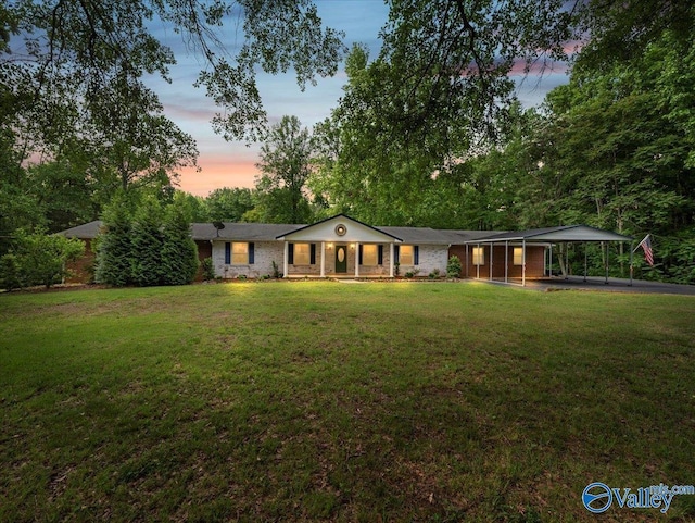 28002 Jennings Chapel Rd, Toney, AL 35773 - ranch-style home featuring a porch, a yard, and a carport