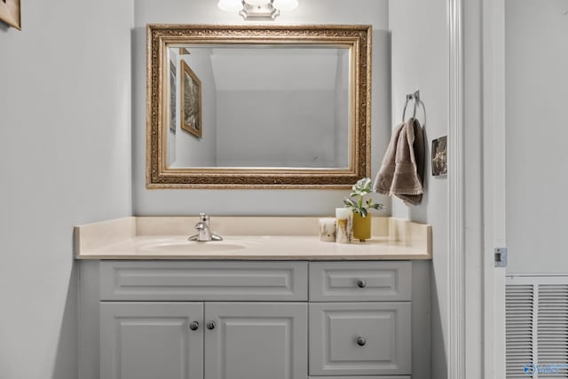 bathroom featuring vanity and visible vents