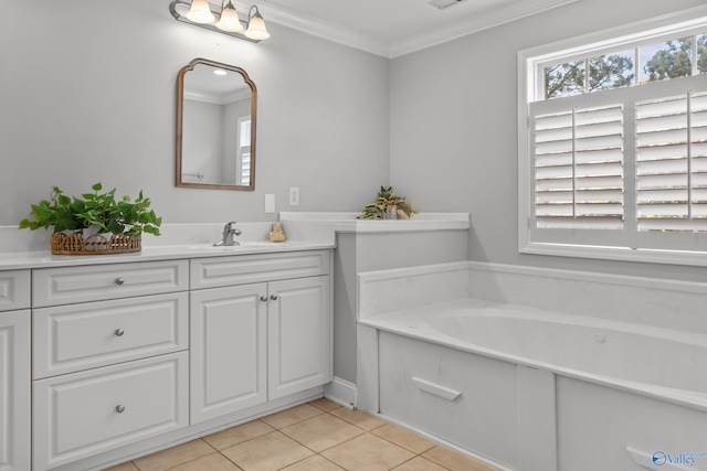 bathroom with crown molding, a bath, vanity, visible vents, and tile patterned floors