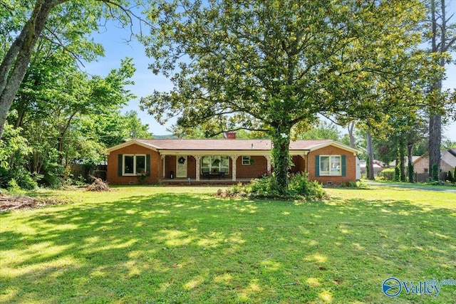 259 Old Big Cove Rd, Brownsboro, AL 35741 - ranch-style house with brick siding, a front yard, and covered porch