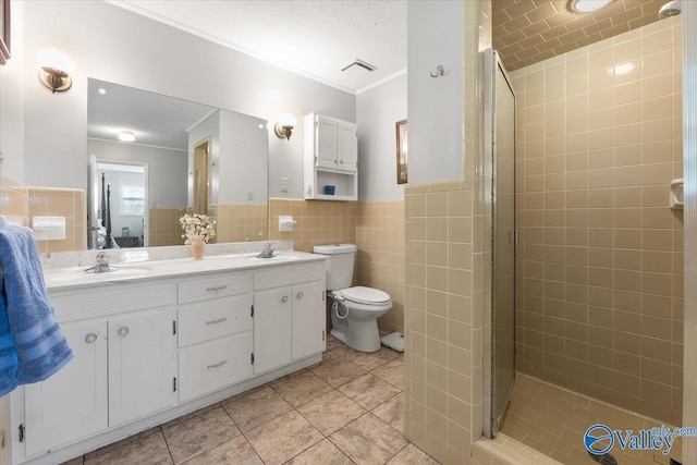259 Old Big Cove Rd, Brownsboro, AL 35741 - bathroom with tile walls, tile patterned flooring, a stall shower, double vanity, and toilet