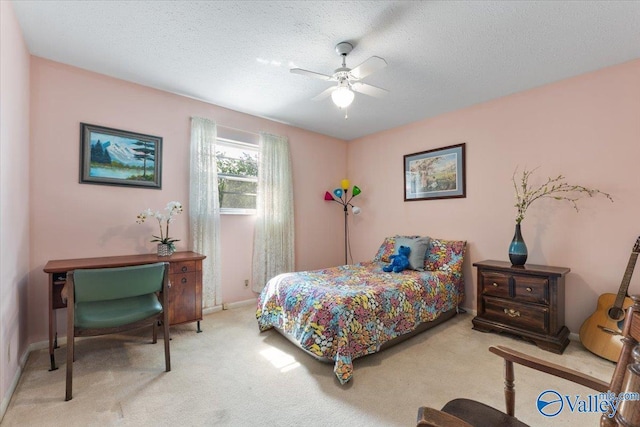 259 Old Big Cove Rd, Brownsboro, AL 35741 - carpeted bedroom with a textured ceiling, baseboards, and a ceiling fan