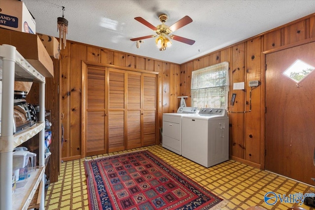 259 Old Big Cove Rd, Brownsboro, AL 35741 - laundry area featuring light floors, washer and dryer, ceiling fan, wooden walls, and a textured ceiling