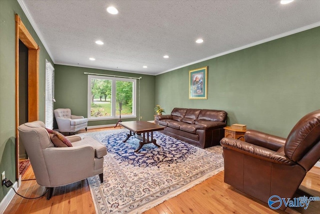 259 Old Big Cove Rd, Brownsboro, AL 35741 - living room featuring recessed lighting, a textured ceiling, wood finished floors, and ornamental molding